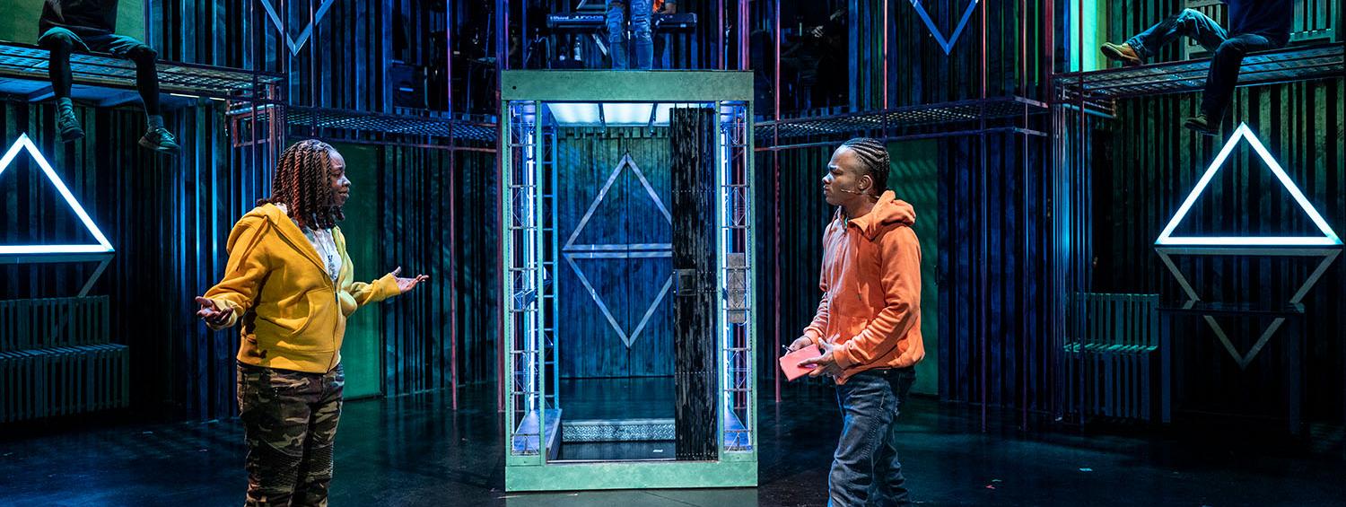 Long Way Down production photo outside the neon elevator is Parris Lewis and Tyrese Shawn Avery.